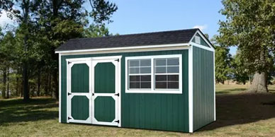 Cottage Shed with a cottage style roof 8ft walls two windows and double barn style doors.
